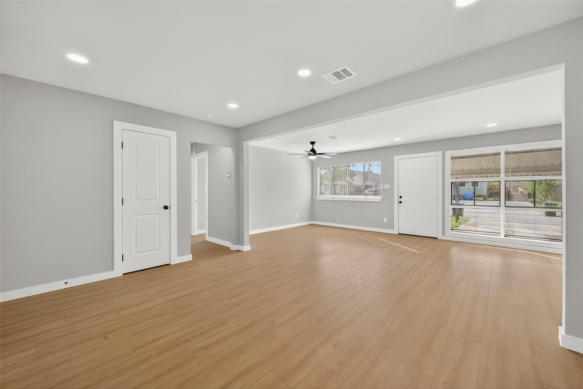 4403 Botany Lane Houston, TX 77047 - Photo 11 of 14 a view of an empty room with wooden floor and a window