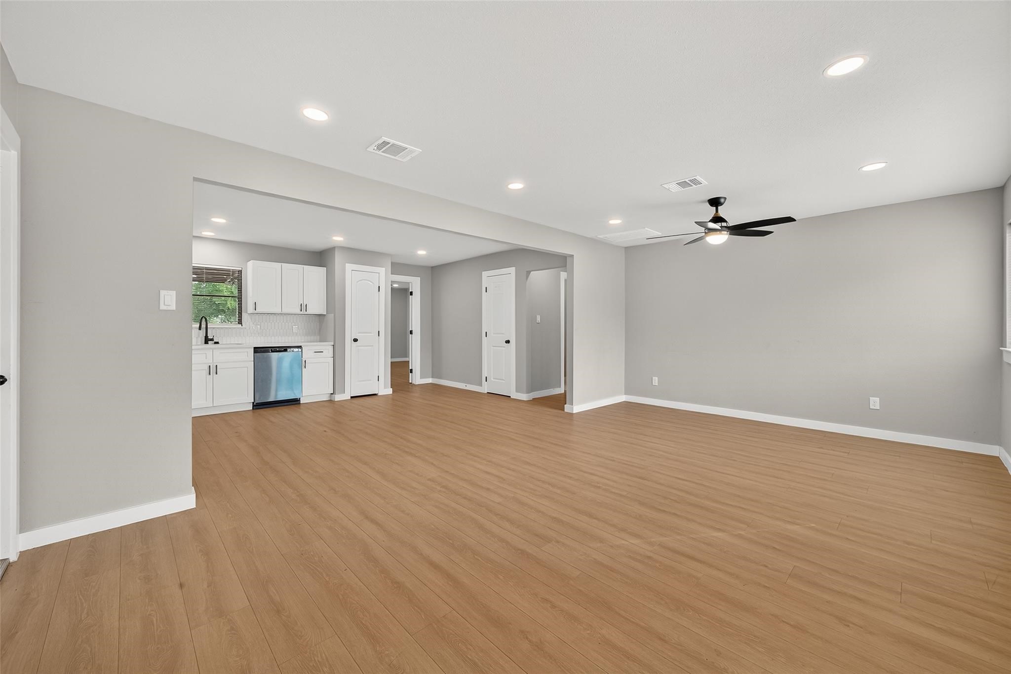 4403 Botany Lane Houston, TX 77047 - Photo 13 of 14 a view of an empty room with wooden floor