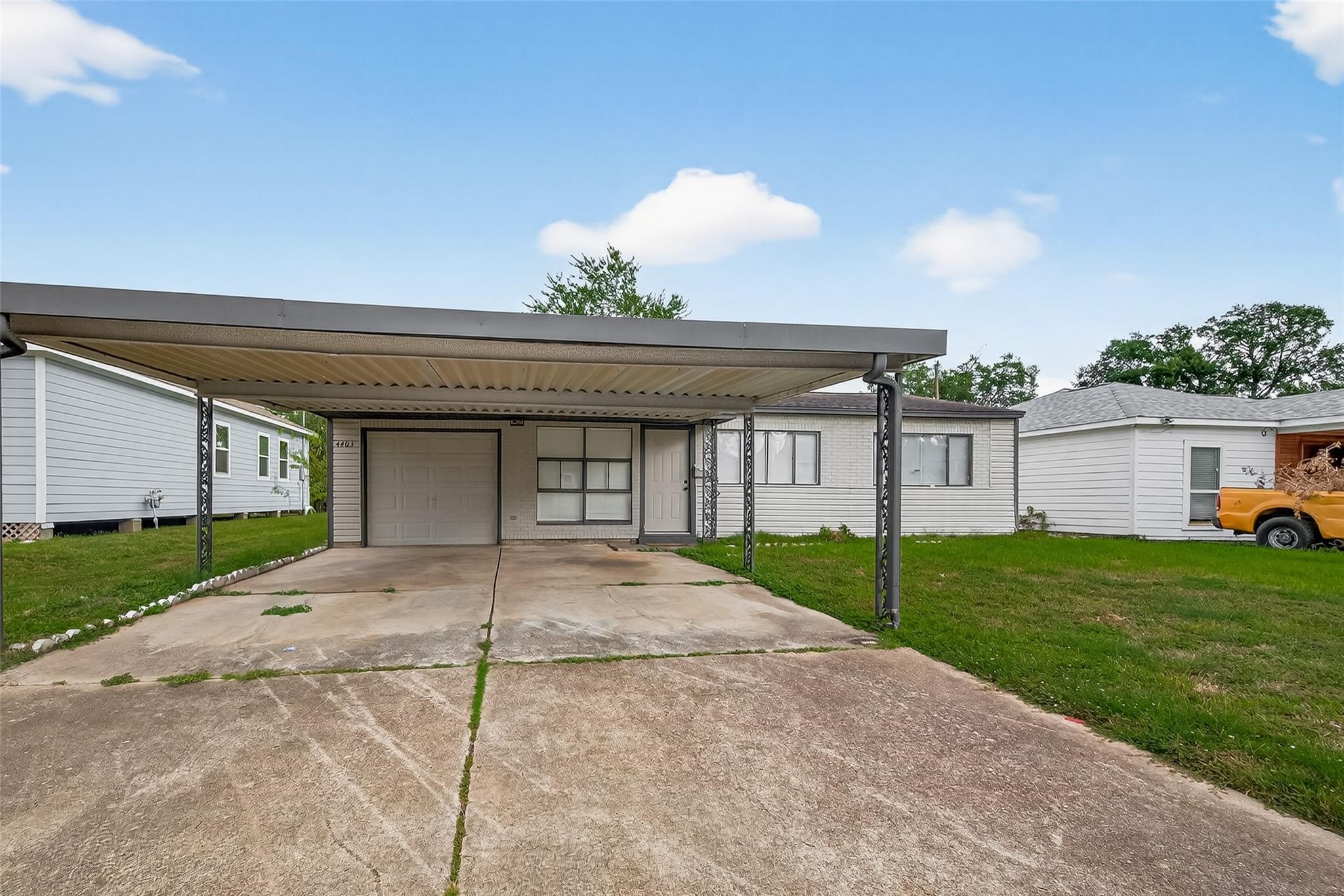 4403 Botany Lane Houston, TX 77047 - Photo 2 of 14 a view of a house with a backyard and a garage