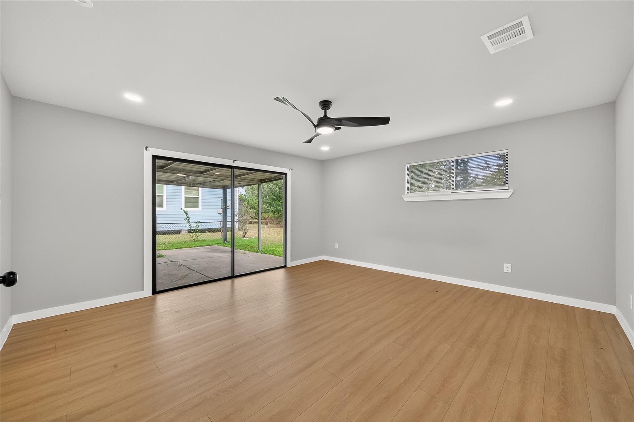 4403 Botany Lane Houston, TX 77047 - Photo 5 of 14 a view of an empty room with a window