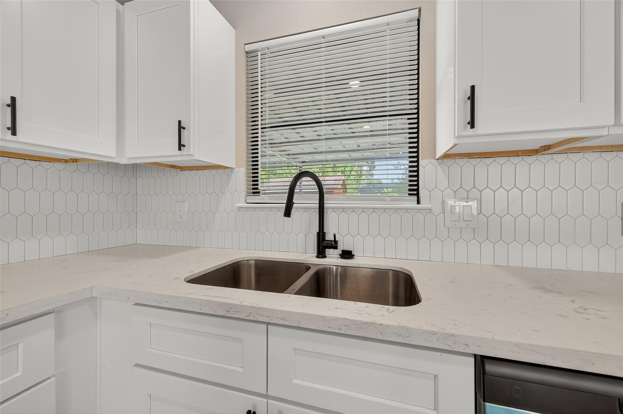 4403 Botany Lane Houston, TX 77047 - Photo 10 of 14 a kitchen with a sink and cabinets