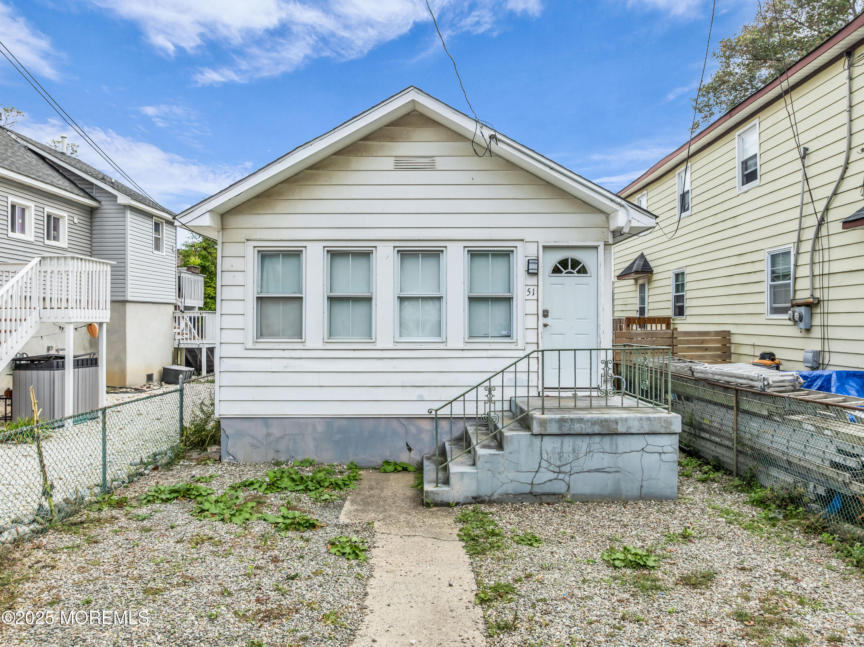 a view of house with backyard