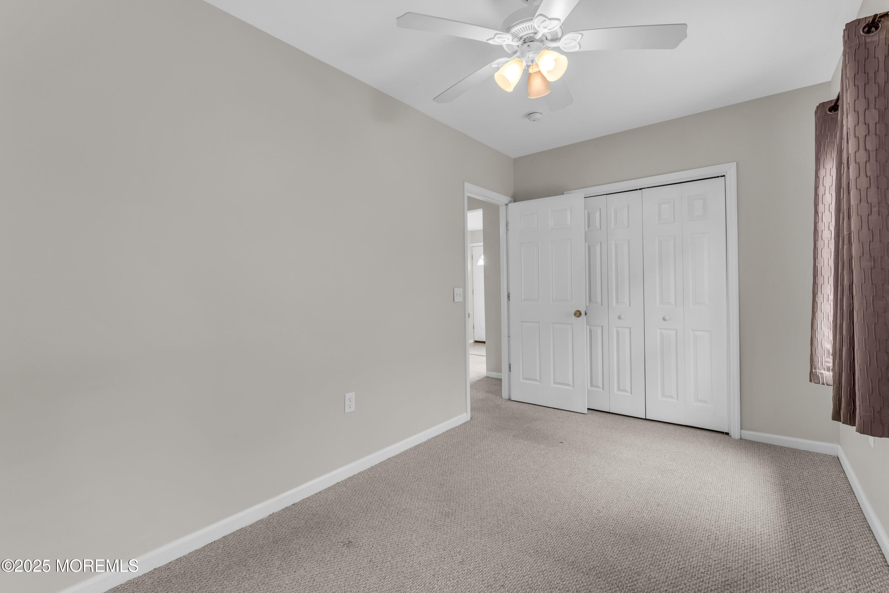 51 Matthew Street Highlands, NJ 07732 - Photo 14 of 19 a view of an empty room and chandelier fan