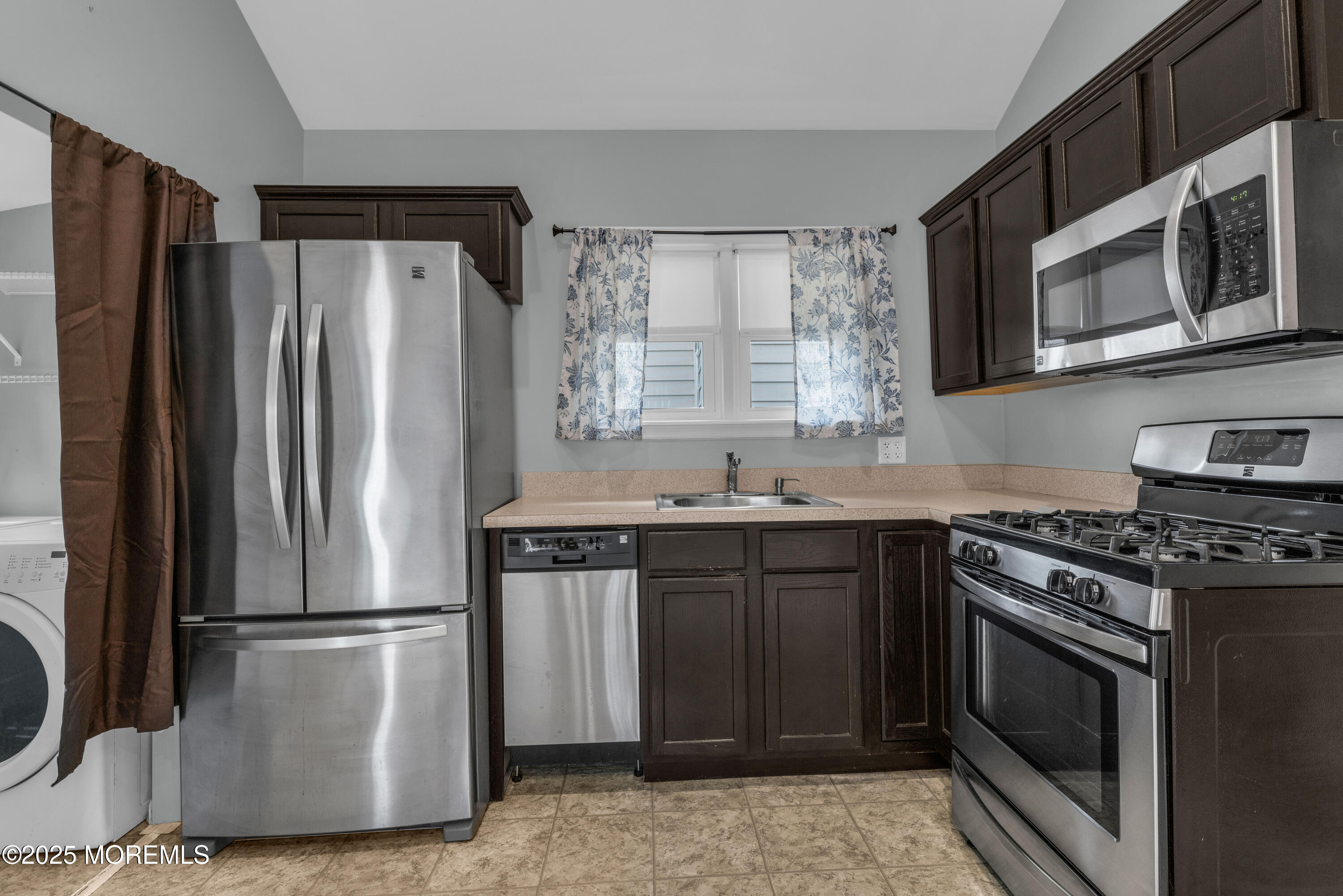 51 Matthew Street Highlands, NJ 07732 - Photo 8 of 19 a kitchen with stainless steel appliances granite countertop a refrigerator stove and sink