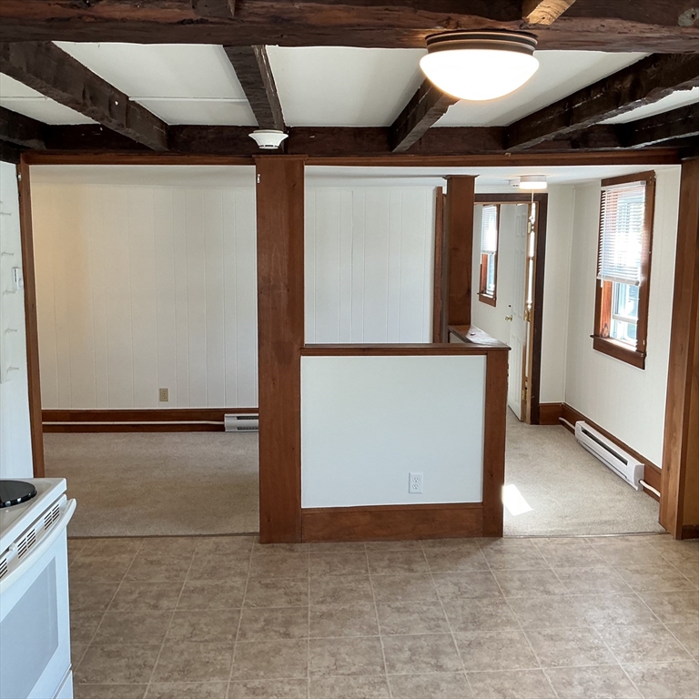 41 High Street, Unit 6 Amesbury, MA 01913 - Photo 9 of 16 a view of an empty room with a window