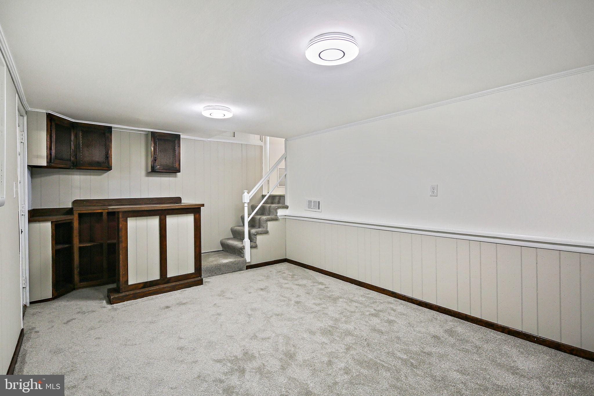 6204 Scranton Road Baltimore, MD 21237 - Photo 22 of 31 a view of an empty room with a fireplace