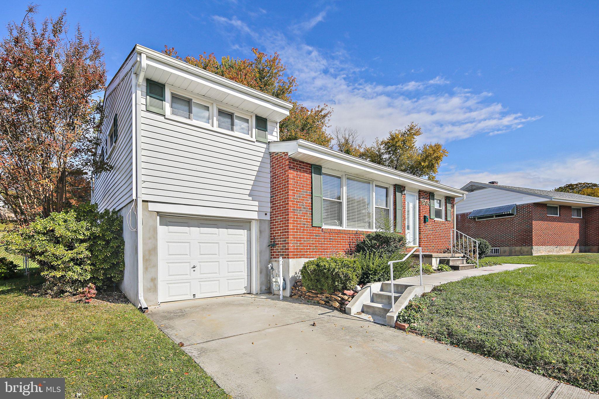 6204 Scranton Road Baltimore, MD 21237 - Photo 31 of 31 a front view of a house with a yard