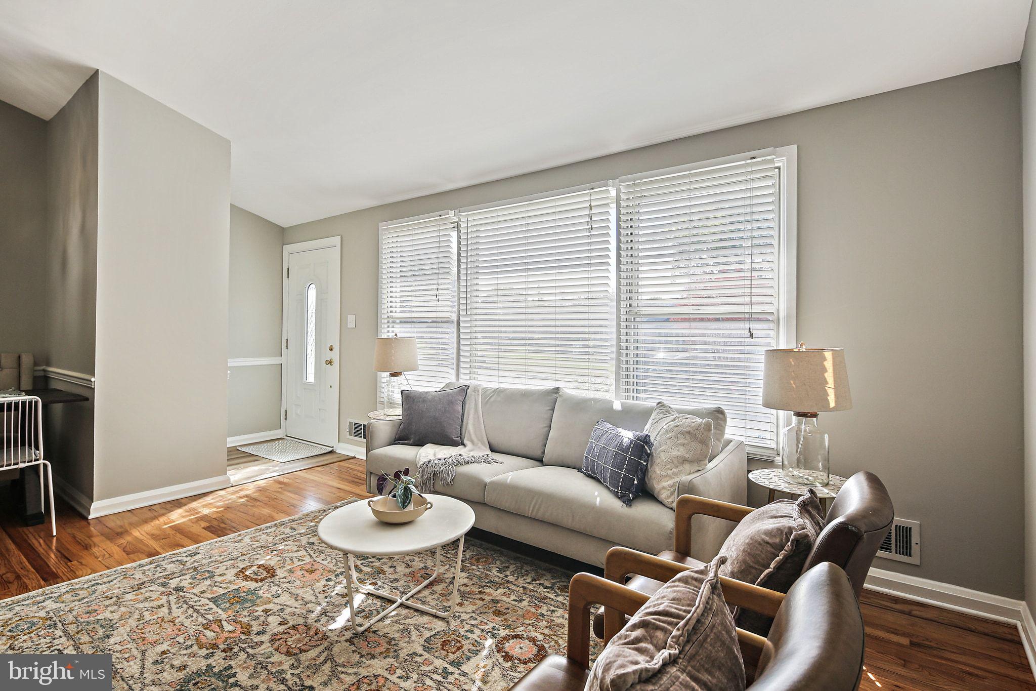 6204 Scranton Road Baltimore, MD 21237 - Photo 5 of 31 a living room with furniture and a large window