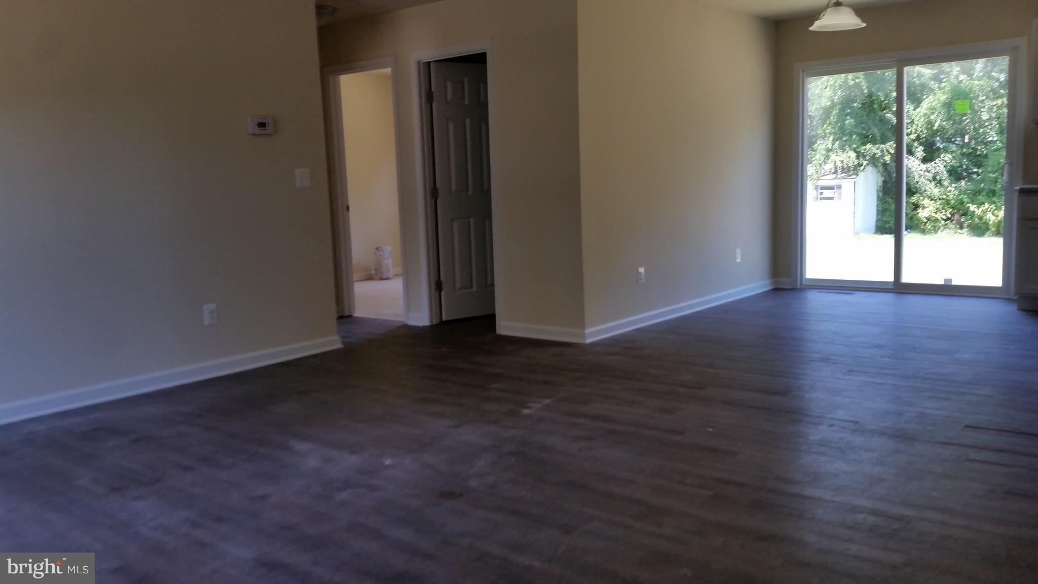 913 Round Top Road Chestertown, MD 21620 - Photo 6 of 12 LIVING ROOM DINING AREA W WOOD LAMINATE FLOORING
