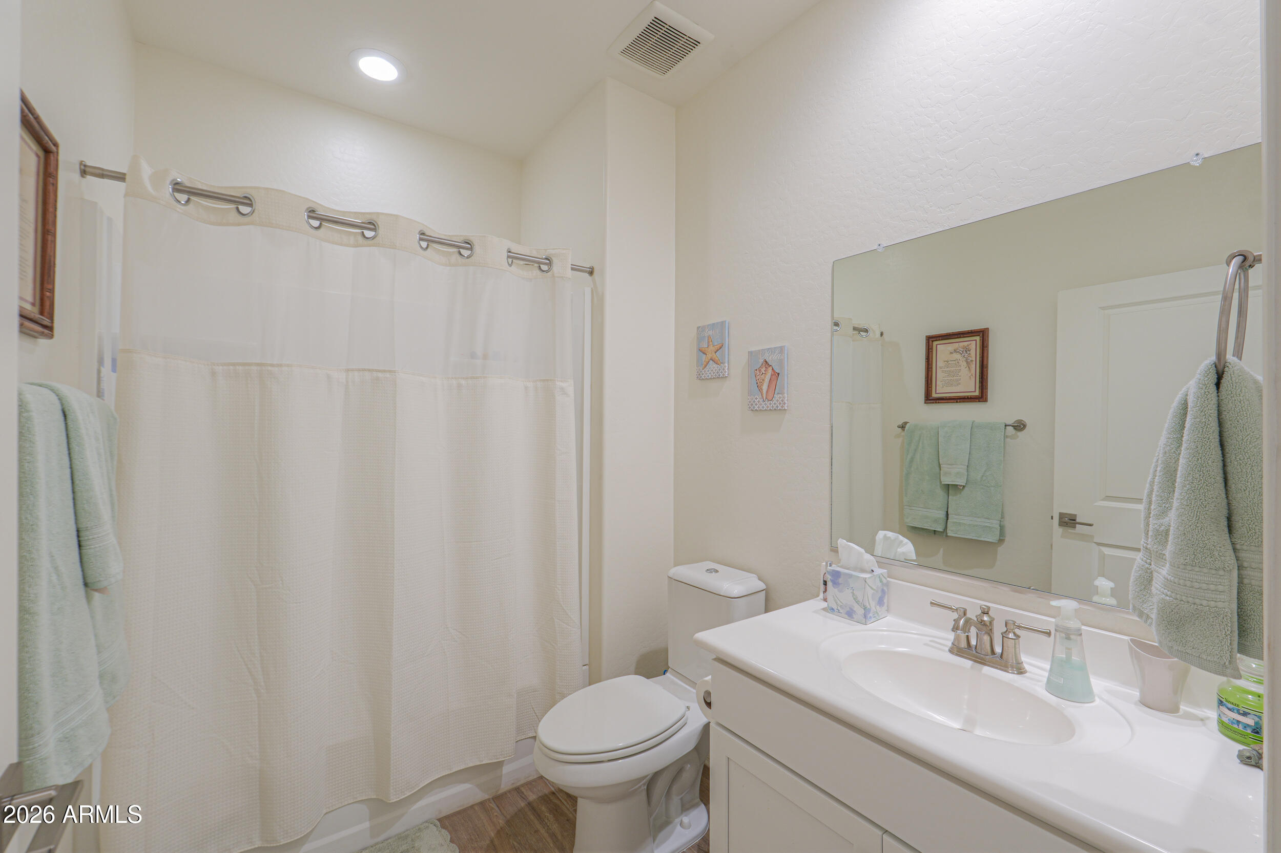 42085 West Cribbage Road Maricopa, AZ 85138 - Photo 16 of 35 a bathroom with a sink toilet and shower