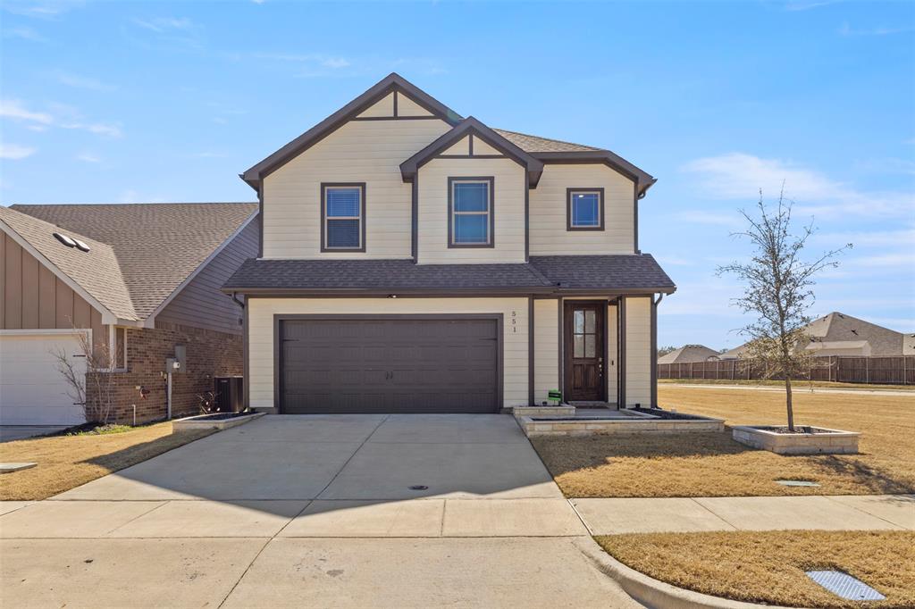 551 Ruthye Lane Pilot Point, TX 76258 - Photo 3 of 40 a front view of a house with a yard
