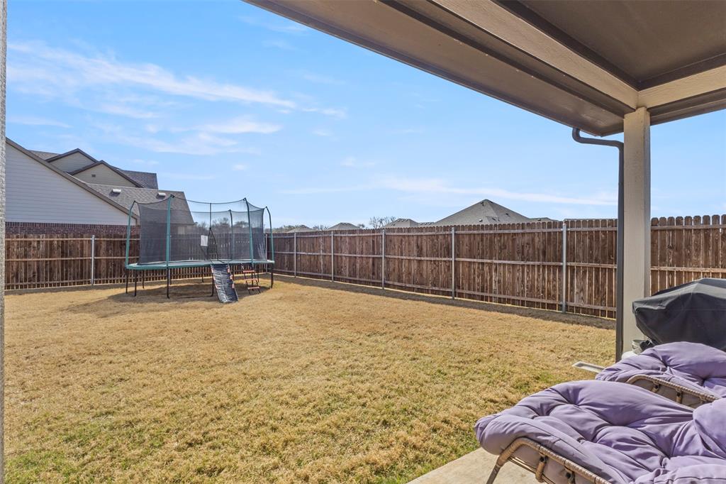 551 Ruthye Lane Pilot Point, TX 76258 - Photo 31 of 40 a view of a swimming pool with a lounge chairs