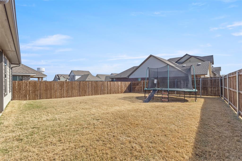 551 Ruthye Lane Pilot Point, TX 76258 - Photo 32 of 40 a view of an house with backyard and pool