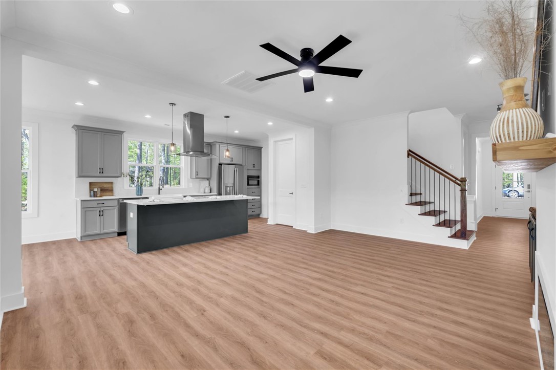 407 Blue Ridge Court Westminster, SC 29693 - Photo 20 of 48 This open concept living area boasts a kitchen island and sleek appliances, perfect for everyday living.
