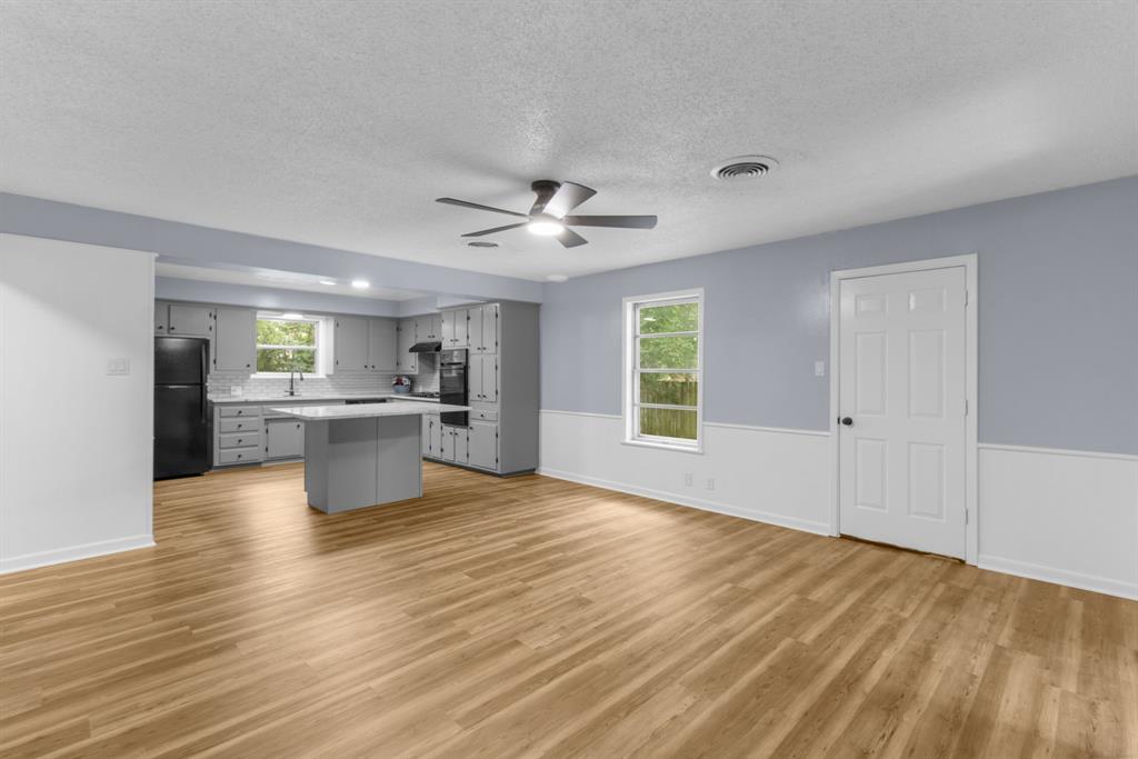 1818 Belden Street Sherman, TX 75092 - Photo 11 of 28 a view of kitchen with wooden floor and window