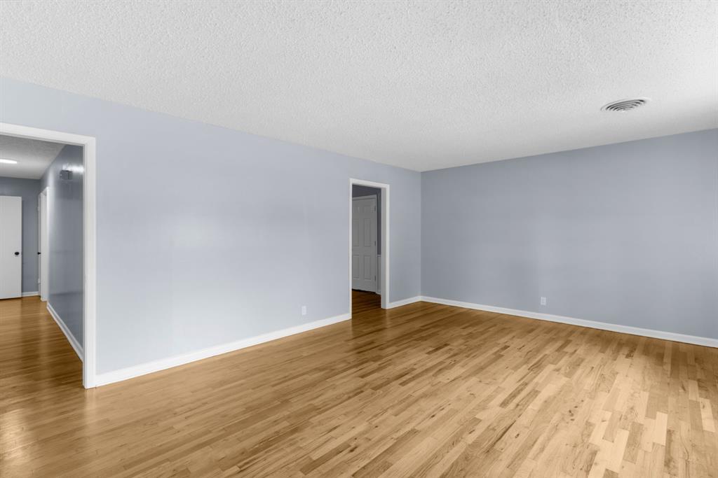 1818 Belden Street Sherman, TX 75092 - Photo 14 of 28 a view of an empty room and wooden floor