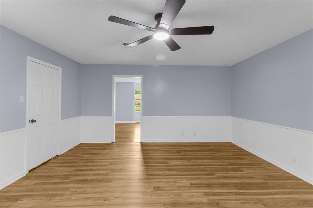 1818 Belden Street Sherman, TX 75092 - Photo 17 of 28 a view of empty room with wooden floor