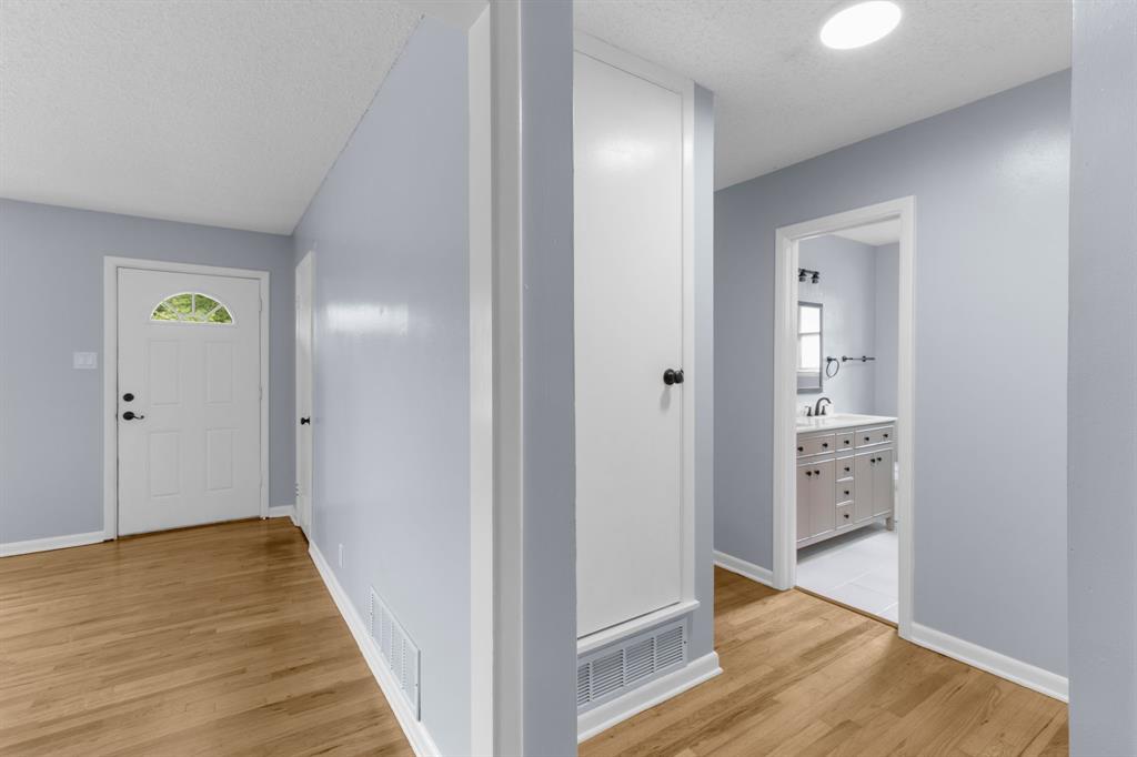 1818 Belden Street Sherman, TX 75092 - Photo 21 of 28 a view of a hallway with wooden floor