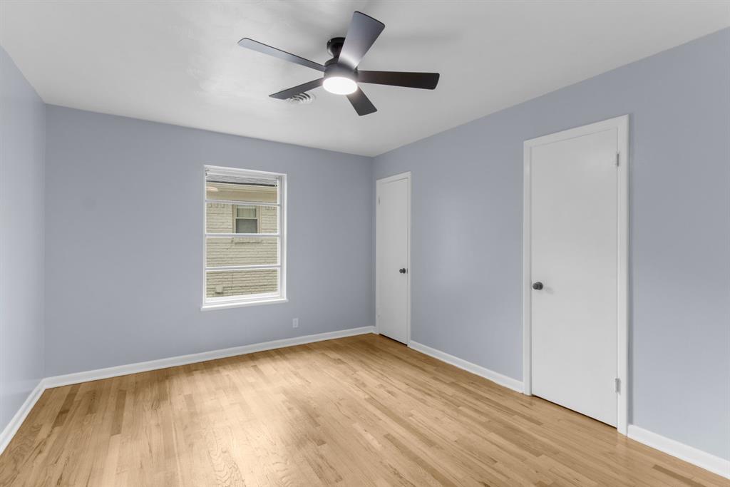1818 Belden Street Sherman, TX 75092 - Photo 22 of 28 a view of empty room with wooden floor and fan