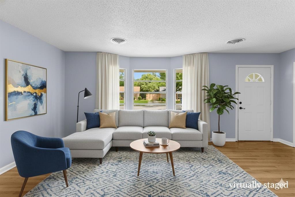 1818 Belden Street Sherman, TX 75092 - Photo 6 of 28 a living room with furniture and a potted plant