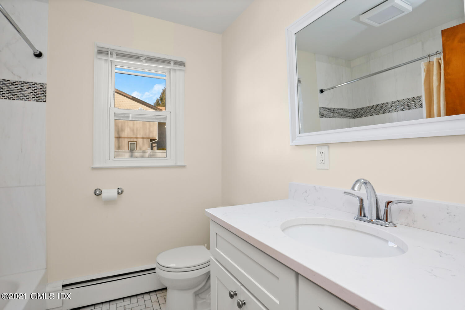29 Thorn Hill Road Riverside, CT 06878 - Photo 13 of 24 a bathroom with a sink toilet and a mirror