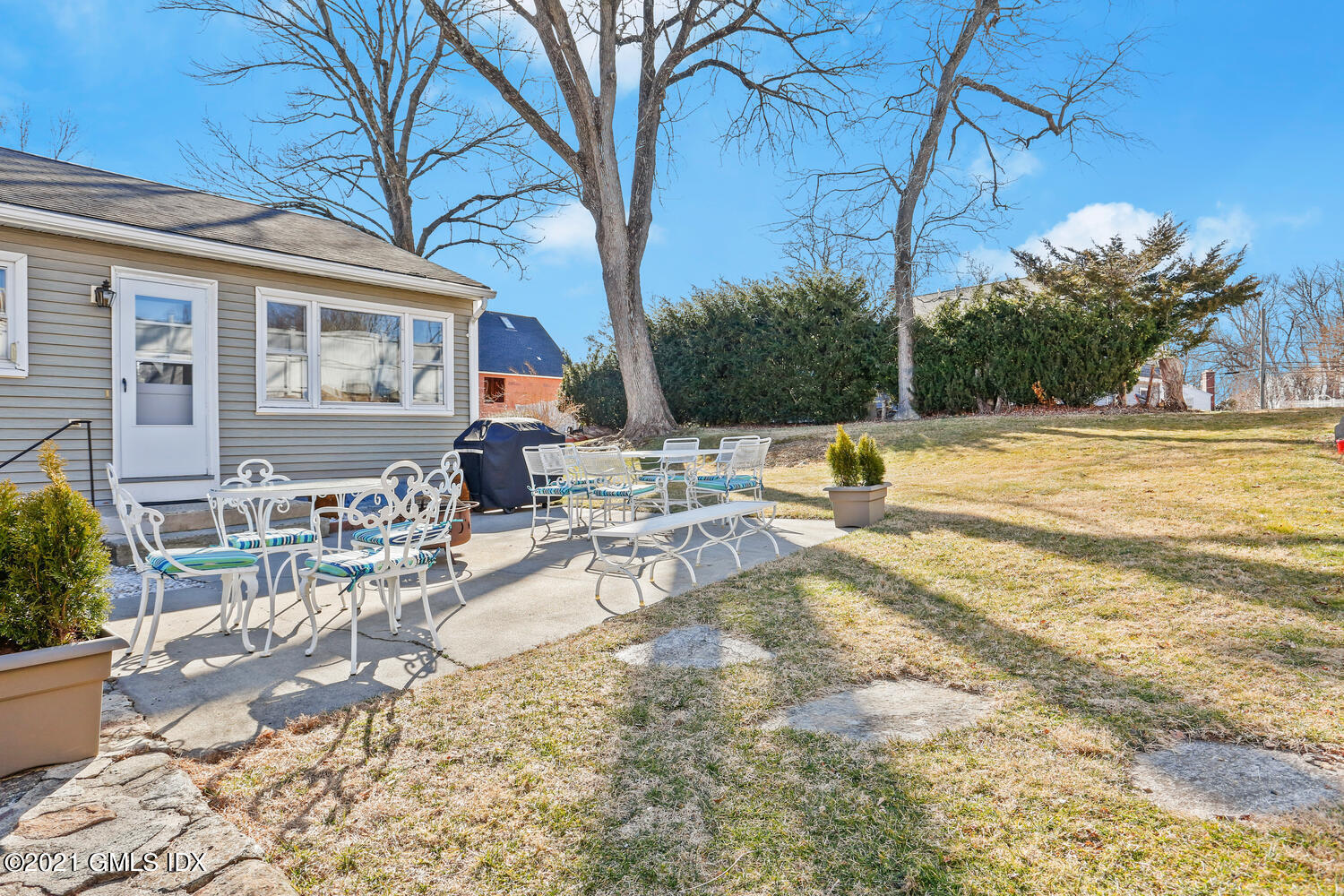 29 Thorn Hill Road Riverside, CT 06878 - Photo 17 of 24 a view of a house with a patio