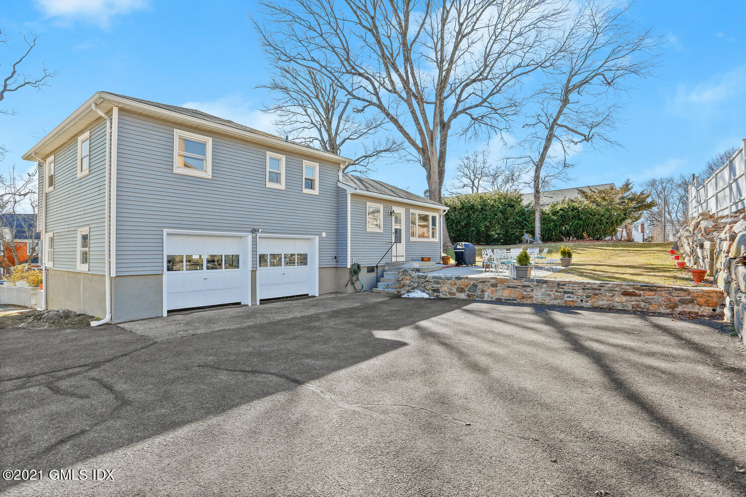 29 Thorn Hill Road Riverside, CT 06878 - Photo 19 of 24 a view of a house with a yard and road