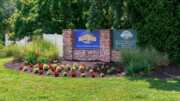 a view of outdoor space with sign board and yard