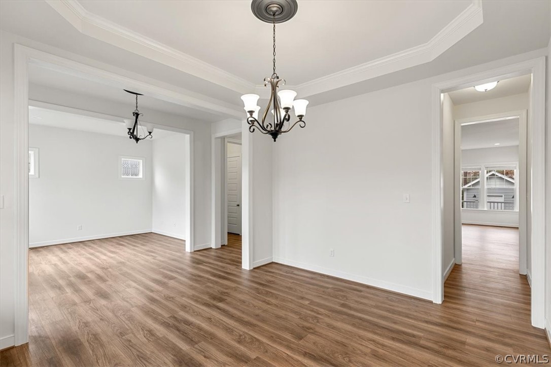 2514 Channelmark Place Chester, VA 23836 - Photo 11 of 50 a view of a hallway with wooden floor and chandelier