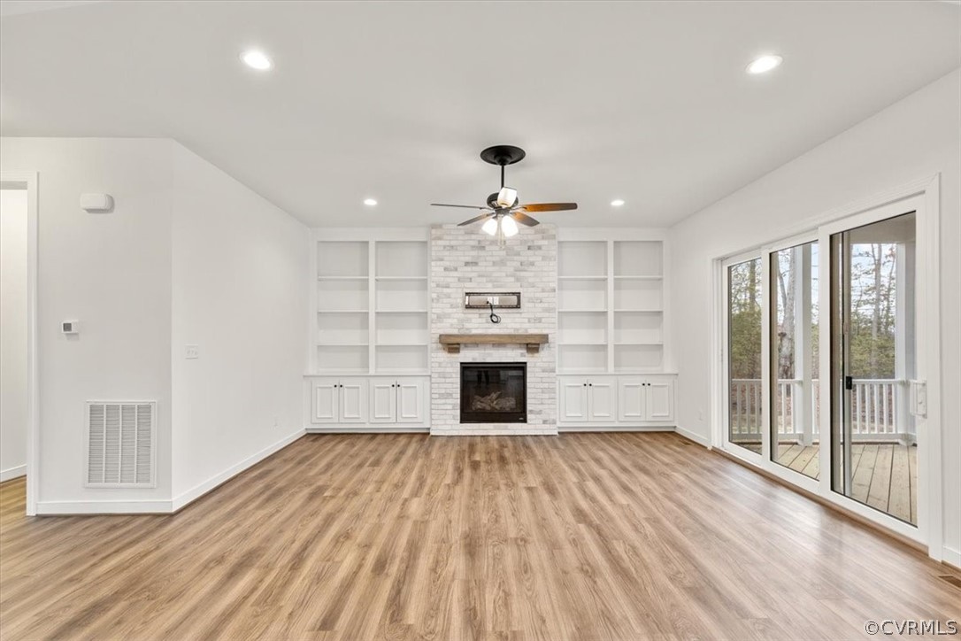 2514 Channelmark Place Chester, VA 23836 - Photo 13 of 50 wooden floor in an empty room with a fireplace