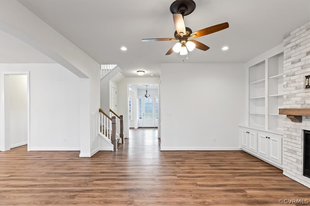 2514 Channelmark Place Chester, VA 23836 - Photo 14 of 50 a view of an empty room and kitchen view with wooden floor