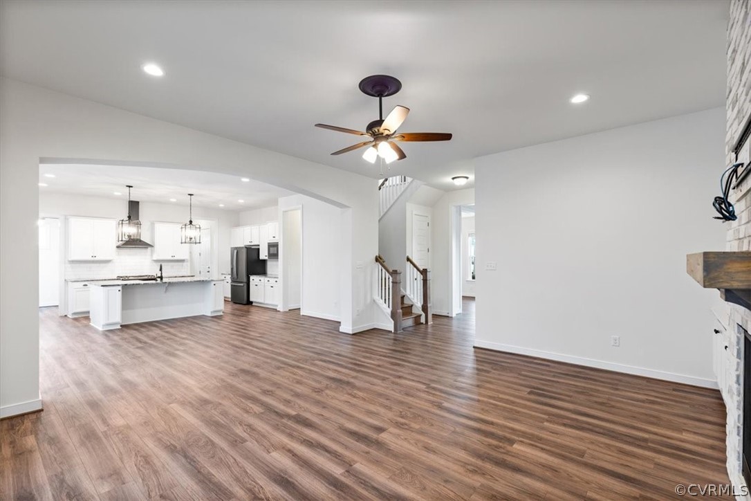 2514 Channelmark Place Chester, VA 23836 - Photo 15 of 50 a view of an empty room with wooden floor and a ceiling fan