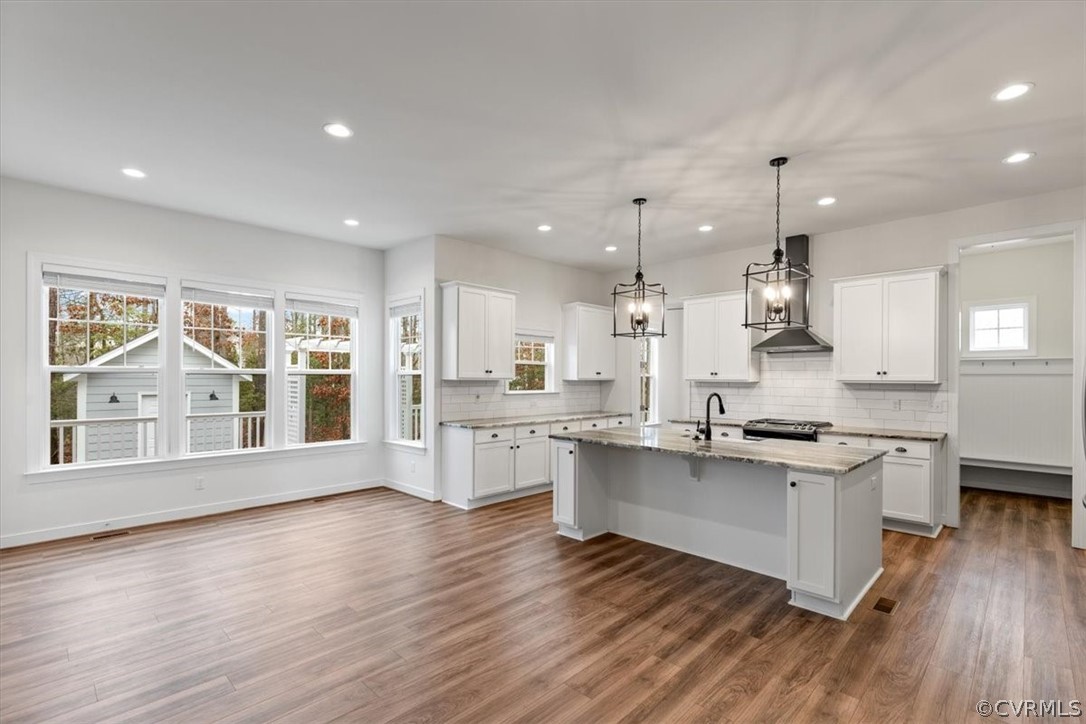 2514 Channelmark Place Chester, VA 23836 - Photo 18 of 50 a large kitchen with lots of counter space wooden floor and appliances