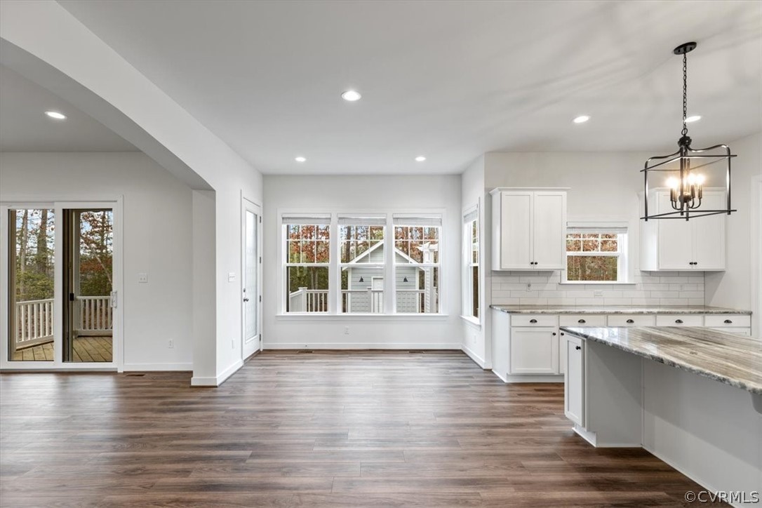 2514 Channelmark Place Chester, VA 23836 - Photo 19 of 50 a view of kitchen with stainless steel appliances granite countertop a stove top oven a sink dishwasher a oven and a large window with wooden floor