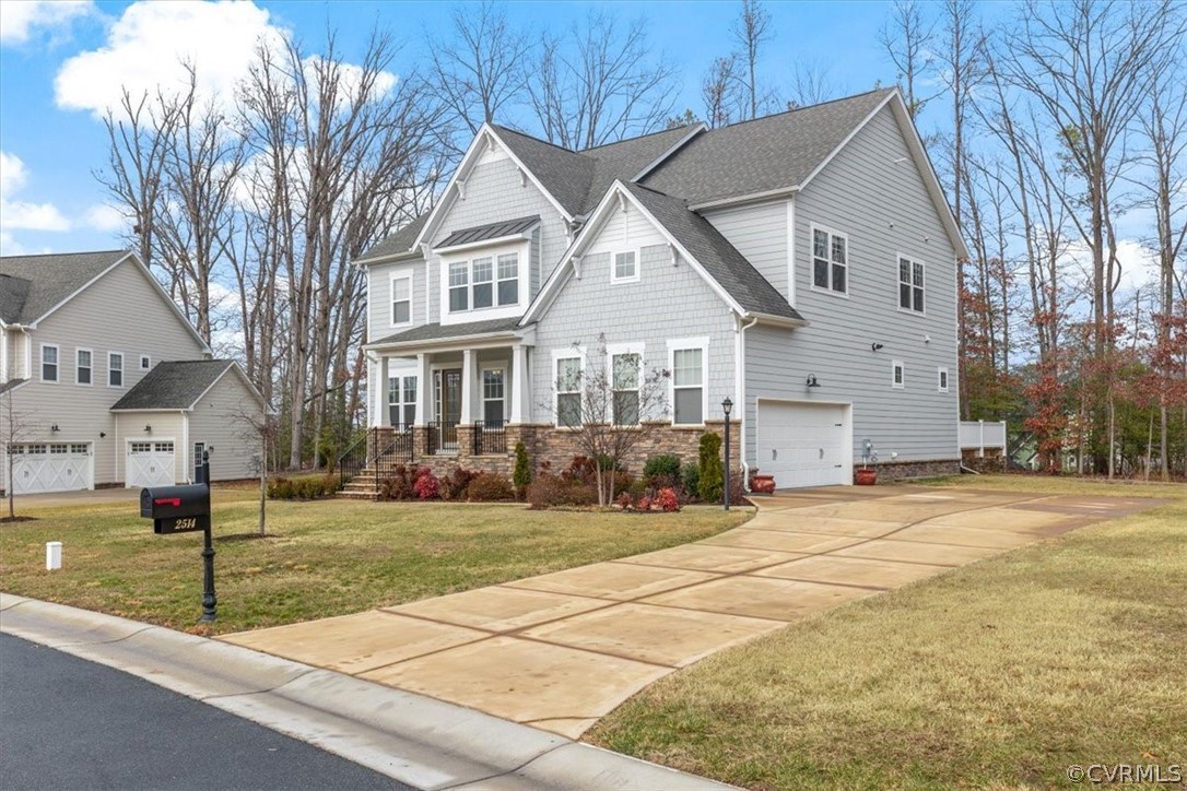 2514 Channelmark Place Chester, VA 23836 - Photo 2 of 50 a front view of a house with a yard