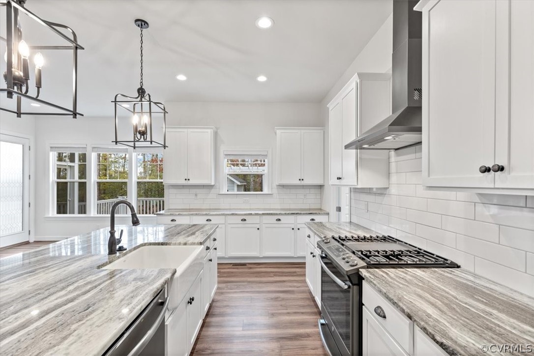 2514 Channelmark Place Chester, VA 23836 - Photo 21 of 50 a kitchen with granite countertop a sink stove and refrigerator