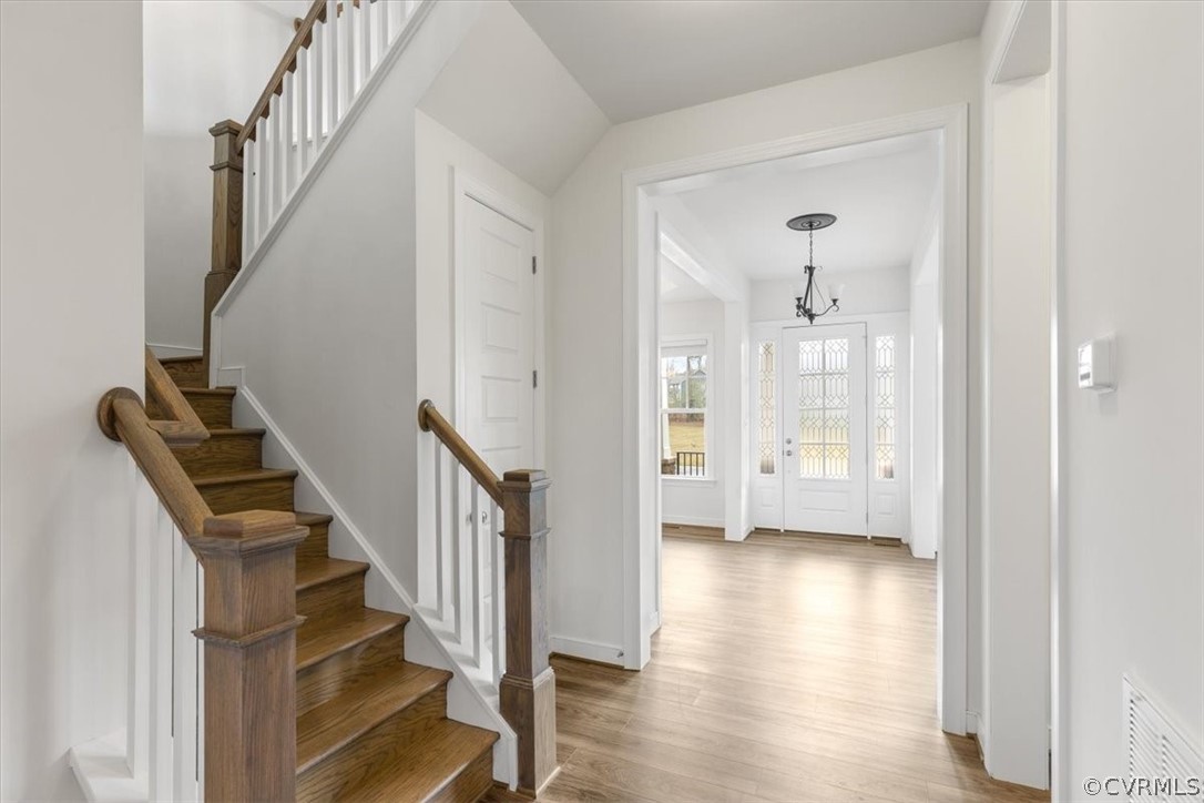 2514 Channelmark Place Chester, VA 23836 - Photo 25 of 50 a view of an entryway with wooden floor and stairs