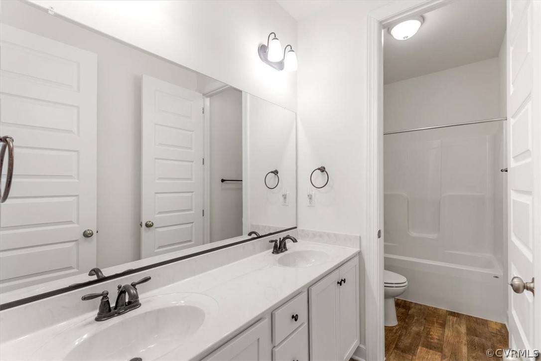 2514 Channelmark Place Chester, VA 23836 - Photo 36 of 50 a bathroom with a sink and a mirror with toilet