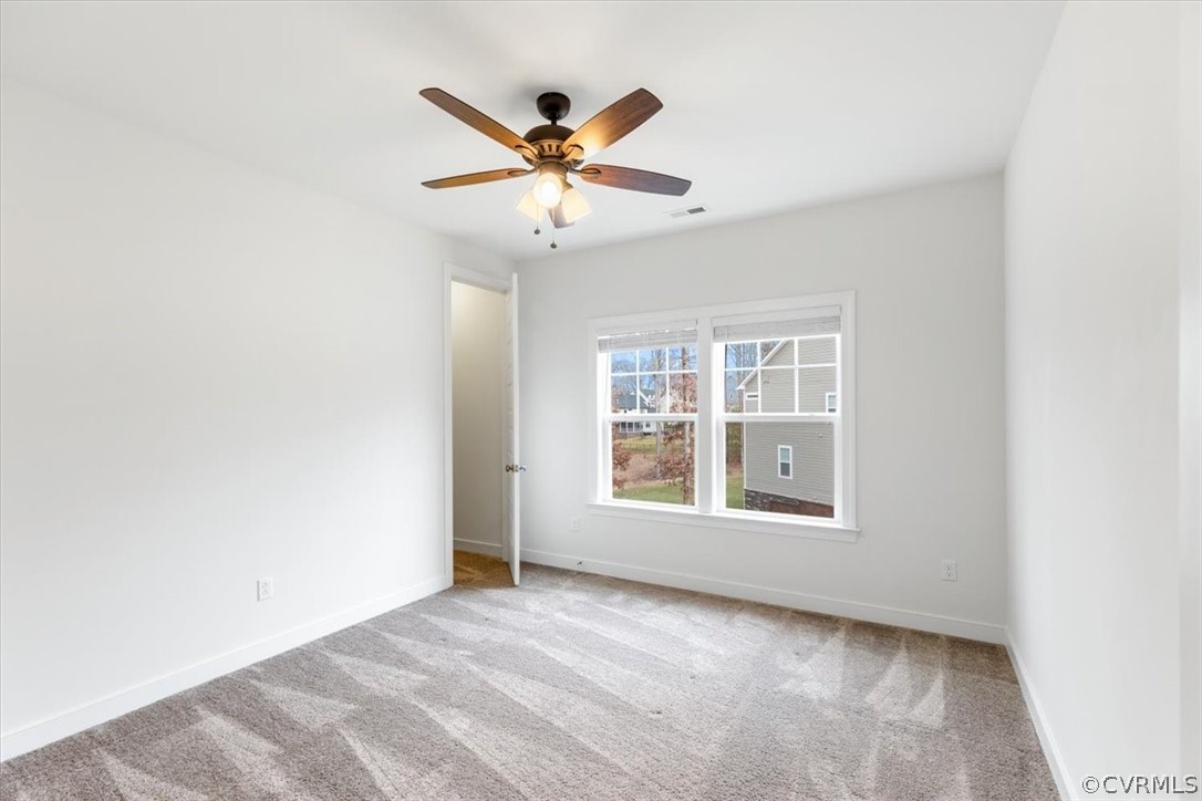 2514 Channelmark Place Chester, VA 23836 - Photo 37 of 50 an empty room with windows and fan