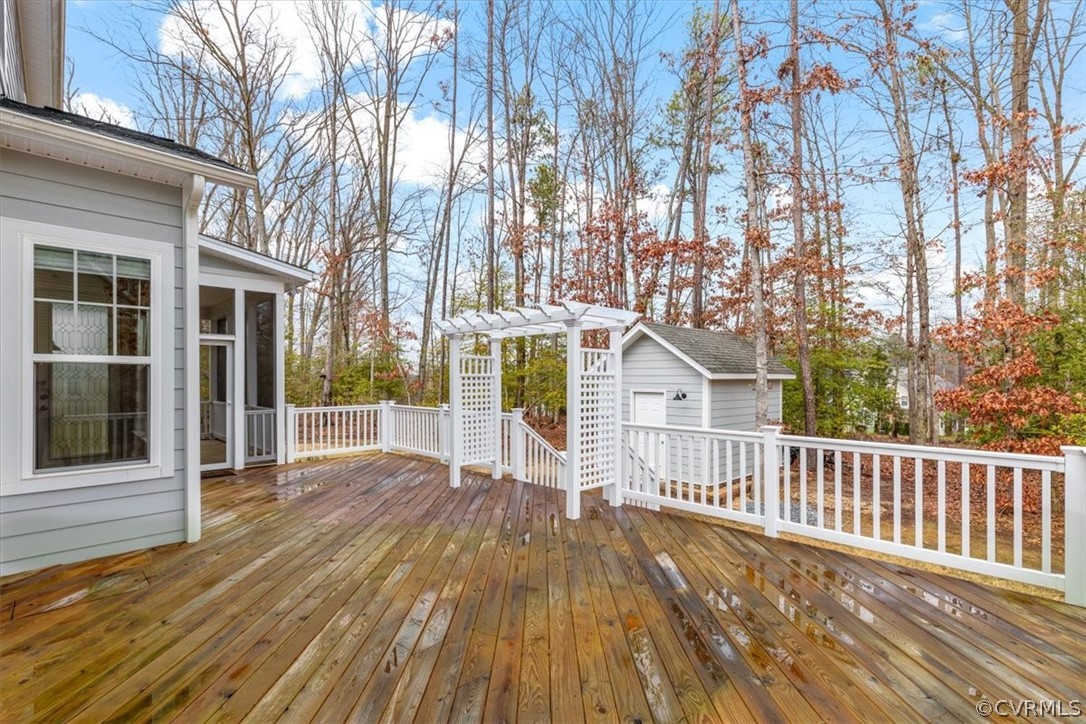 2514 Channelmark Place Chester, VA 23836 - Photo 43 of 50 a view of backyard with deck and wooden floor
