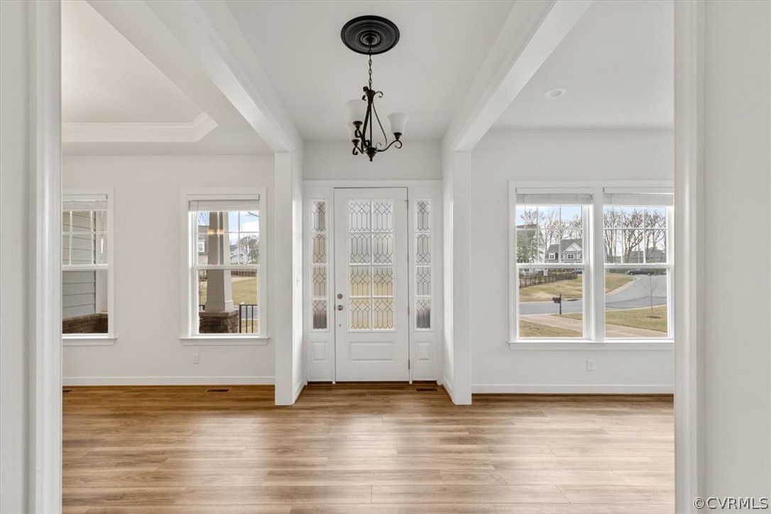 2514 Channelmark Place Chester, VA 23836 - Photo 6 of 50 a view of an empty room with window and wooden floor