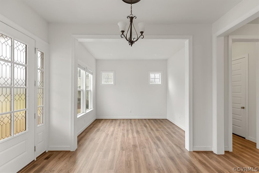 2514 Channelmark Place Chester, VA 23836 - Photo 8 of 50 a view of empty room with wooden floor and fan