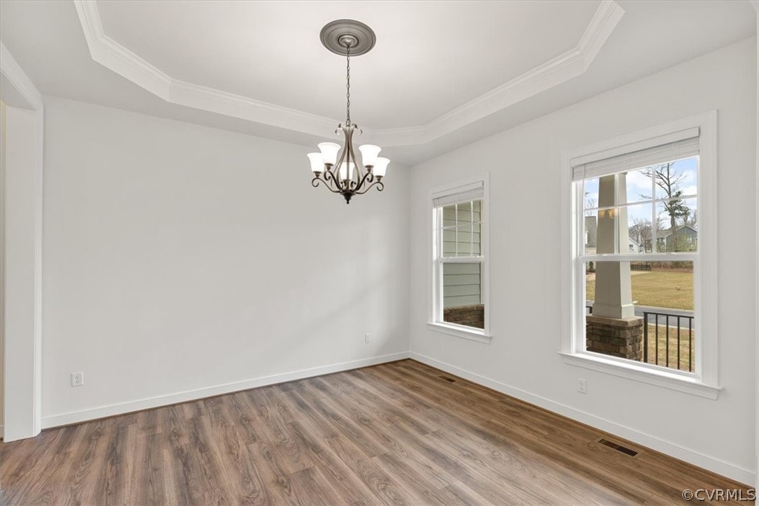 2514 Channelmark Place Chester, VA 23836 - Photo 10 of 50 a view of an empty room with wooden floor and a window