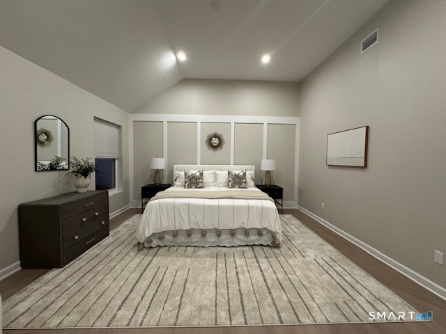 74 Soundview Avenue Fairfield, CT 06825 - Photo 11 of 32 a spacious bedroom with a bed and a dresser