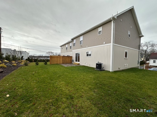 74 Soundview Avenue Fairfield, CT 06825 - Photo 23 of 32 a view of an white house with a big yard