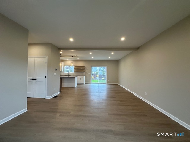 74 Soundview Avenue Fairfield, CT 06825 - Photo 26 of 32 a view of an empty room and a kitchen
