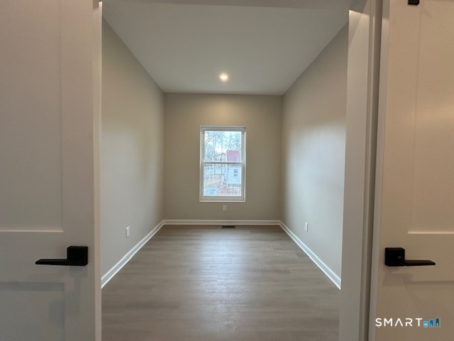 74 Soundview Avenue Fairfield, CT 06825 - Photo 27 of 32 a view of an empty room with a window