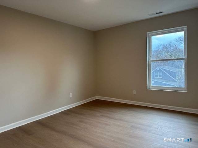 74 Soundview Avenue Fairfield, CT 06825 - Photo 31 of 32 an empty room with a window