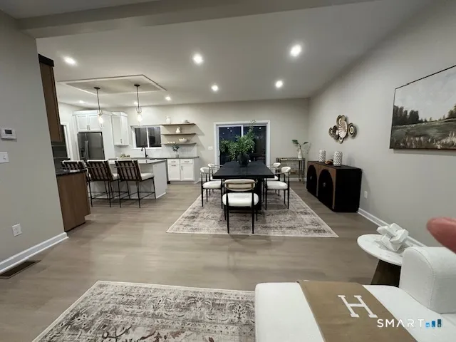 a living room with furniture and a rug