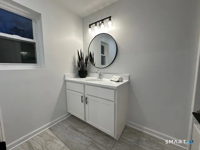 a bathroom with a toilet and a sink